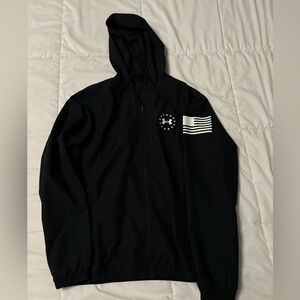 Men’s Under Armour full zip hooded windbreaker.  Small